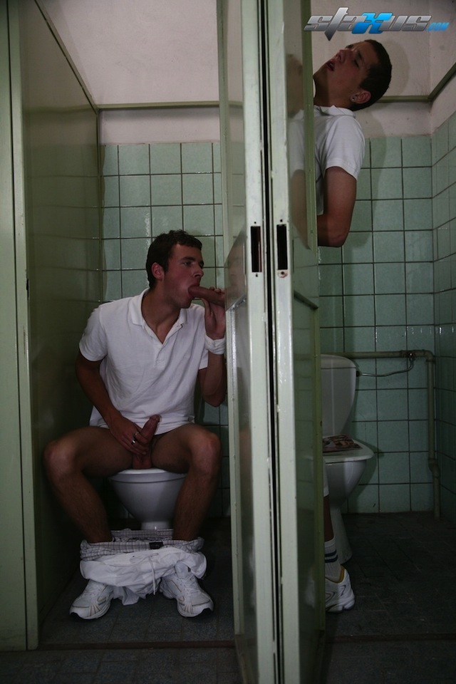 Two horny twinks share their uncut cocks in the mens room (2)
